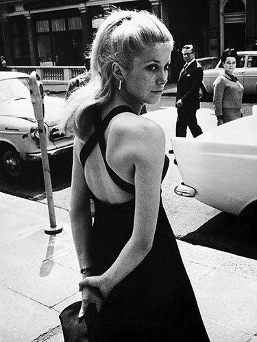 Catherine Deneuve in London, 1964 An open-back dress is an understated way to show a little skin. Try one for a summer wedding or cocktail party. (photo/Agencies)