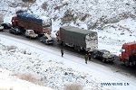 Snow hits NW China's Hami, causing traffic jam