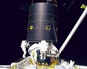 First three-person spacewalk