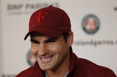 Federer out of spotlight at French Open