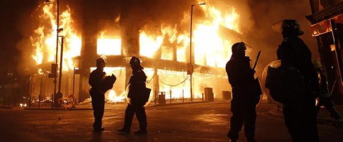 London rioters attack police
