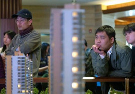 China asserts grip on housing market